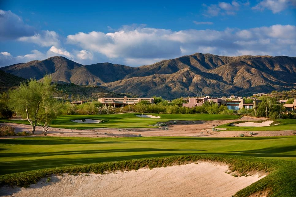 A view of a golf course and house property in Scottsdale, AZ